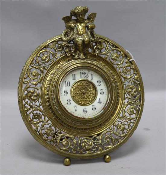 A brass putti mantel clock